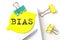 BIAS text on yellow sticker on notebook with pen