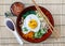 Bibimbap in a bowl, korean dish from top.