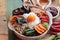 Bibimbap korean food is delicious on wood background.