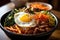 Bibimbap is a popular Korean rice bowl dish served in a traditional Korean restaurant