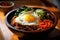 Bibimbap is a popular Korean rice bowl dish served in a traditional Korean restaurant