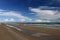 Bibione beach Italy with clear blue sky and sun umbrellas