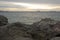 Bible message in a rock at ViÃ±a del Mar beach, Chileâ€™s Pacific Ocean coast in a calm and beautiful sunset.