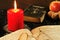 Bible, songbook and candle