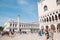 Biblioteca Nazionale Marciana and Doge`s Palace with crowd at Piazza San Marco in Venice, Italy