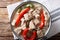 Bicol Express with red and green chili close-up in a bowl. horizontal top view