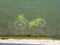 A bicycle abandoned under the water