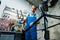 Bicycle assembly in workshop, man installs fork