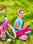 Bicycle child wearing headset listening music. Playing on tablet pc.