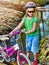 Bicycle children with ladies bikes in summer park.