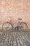Bicycle on Cobble Stone against Brick Wall; Groot Begijnhof; Leuven