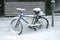 Bicycle covered with snow