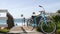 Bicycle cruiser bike by ocean beach, California coast USA. Summertime cycle, stairs and palm trees.