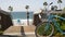 Bicycle cruiser bike by ocean beach, California coast USA. Summertime cycle, stairs and palm trees.