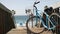 Bicycle cruiser bike by ocean beach, California coast USA. Summertime cycle, stairs and palm trees.