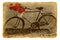Bicycle decorated by red geraniums