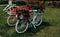 bicycle decorated with red geraniums decoration in the garden