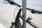 Bicycle detail with a lock chained to a metal pole, theft protection concept