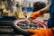Bicycle factory, worker sets star on bike wheel