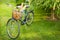 Bicycle with food products (groceries) in the basket.