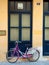 Bicycle in front of an old building in an empty street, Greece