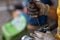 Bicycle gear Being removed for repair By a mechanic wearing white cloth gloves stained with oil on a mountain bike