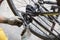 Bicycle gear Being removed for repair By a mechanic wearing white cloth gloves stained with oil on a mountain bike