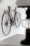 Bicycle hanging on white wall room interior