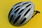 Bicycle helmet for cyclist.Protective helmet.Yellow background.