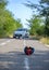 bicycle helmet fallen on the asphalt next to a bicycle after car accident on the street