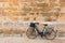 Bicycle in historical Ciutadella stone wall at Balearics