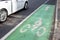 Bicycle Lane Marked in Green along a Busy Street