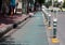 bicycle lane with signs poles array with pathway on PHRA AHTIT road along CHAO PHRAYA river in BANGKOK