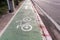 Bicycle lane with a symbol of bike along highway. Bike path.