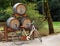 Bicycle leans against wine barrels