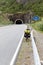 bicycle with luggage stands in front of a tunnel, Lofoten, Nordland, Norway