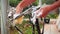 Bicycle maintenance. Bike mechanic cleaning bike with soap foam and washcloth on backyard of repair shop. Man washing his road bic