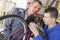 Bicycle mechanic and apprentice repairing bike in workshop