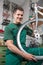 Bicycle mechanic repairing wheel on bike in a workshop