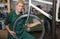 Bicycle mechanic repairing wheel on bike in a workshop