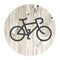 Bicycle minimalistic icon on aged wooden wall background