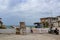 Bicycle and a motorcycle parked near a pier and old weather beaten houses near Progesso Yucatan Mexico 7 - 06 - 2017