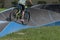 A bicycle moves fast on a pump track, Caslano, Switzerland