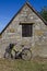 Bicycle with old stone house