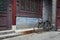 A bicycle parked against an ornamented wall in the Great Mosque in the city of Xian, China