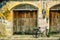 A bicycle parked in front of an ancient yellow house with old wooden doors , Chanthaburi

, Thailand