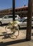 Bicycle parked on pavement decorated with flowers