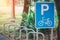 Bicycle parking and bike park signs in the park, with sunshine