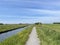 Bicycle path next to a canal at the Weerribben-Wieden National Park