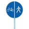 Bicycle and pedestrian lane road sign on pole post, large blue round isolated bike cycling and walking walkway footpath route